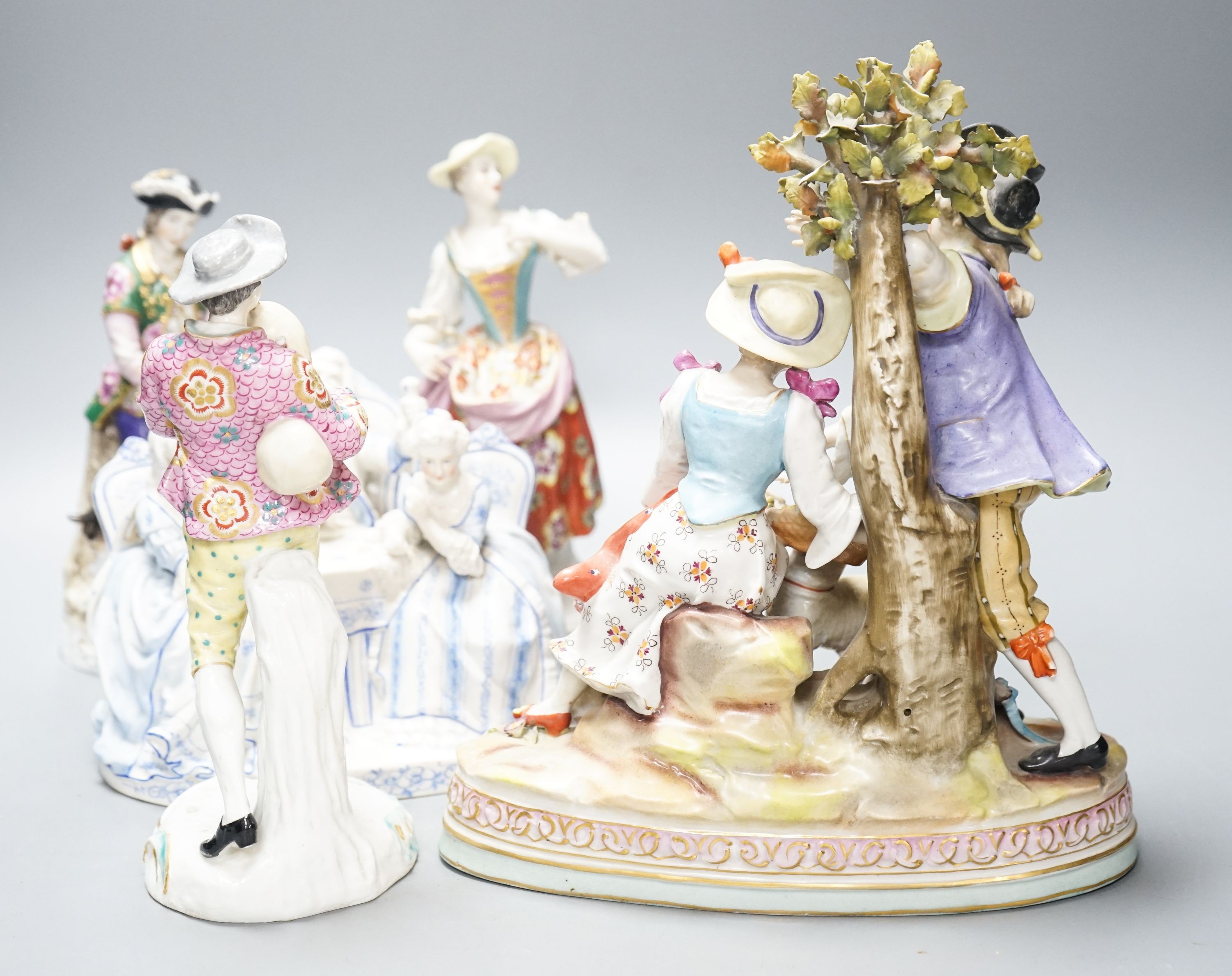 A Sitzendorf group of a Shepherd and shepherdess, three other Continental costume figures and a group (5) 27cm